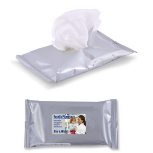 A silver pouch of wet wipes with a white tissue partially exposed. The pouch features a logo.
