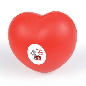 A red heart-shaped stress reliever with a circular label featuring the text "Health Training Aged Care."