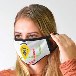 A cotton face mask in white with black edges, featuring a colorful train graphic and logo.