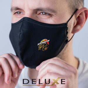 A face mask featuring an embroidered logo of a hypercar, presented by Deluxe.