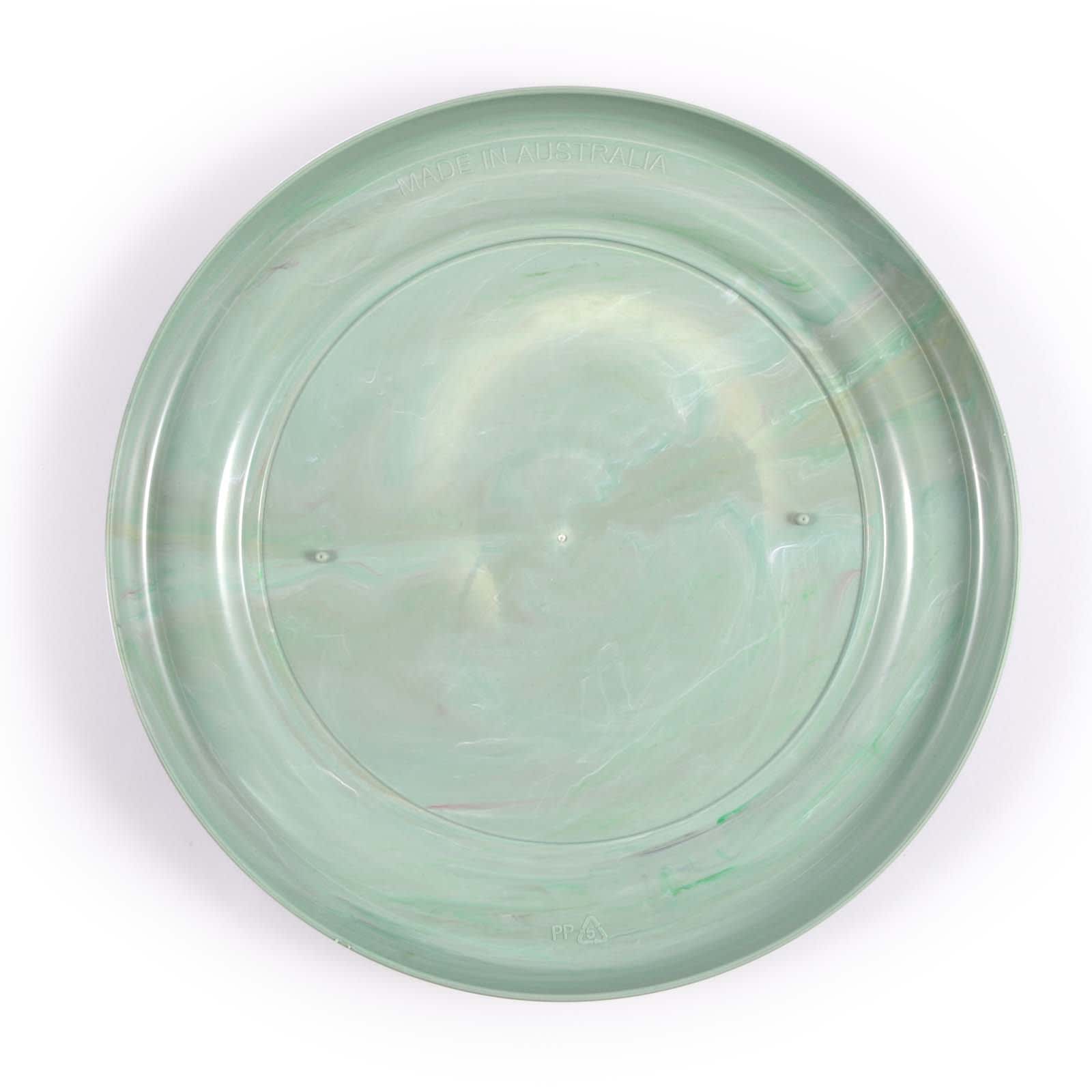 A round, translucent green flyer with a smooth surface and a subtle marbled effect. Features a logo on the bottom.