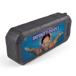 A black and blue water-resistant speaker featuring a protective casing and an image of a swimmer on the front.