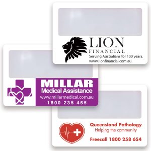 A collection of credit card-sized magnifiers in white, featuring various logos and branding in purple and black.