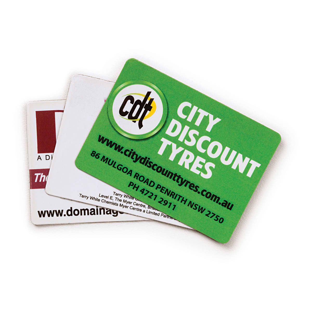 A set of fridge magnets featuring rounded corners in green and white, with logos and contact information.
