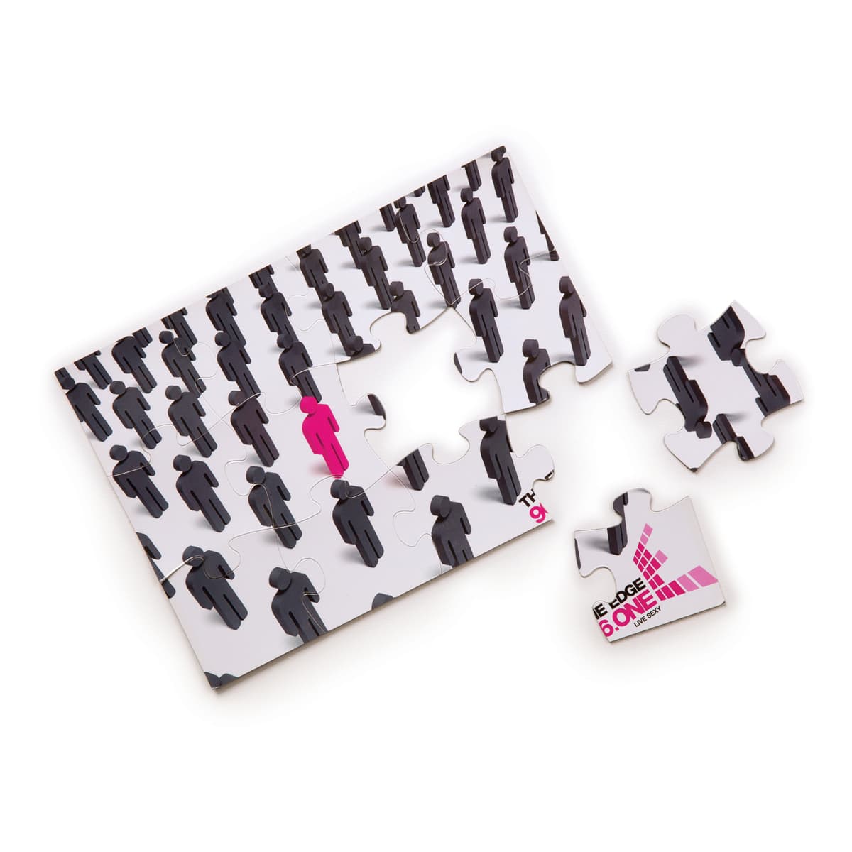 A5 jigsaw puzzle featuring a design of black figures with one pink figure, alongside several loose pieces.