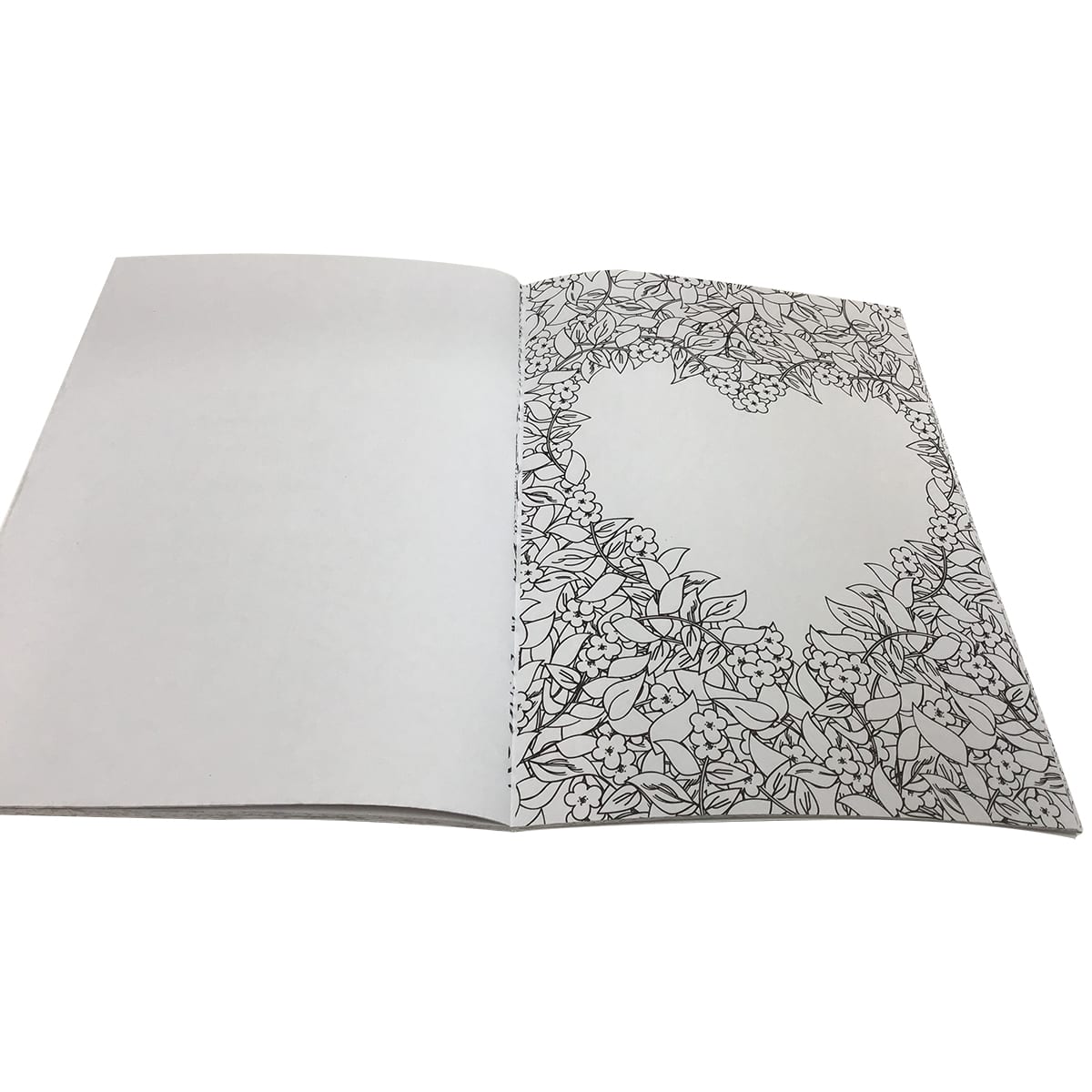 A5 colouring book with intricate floral designs on one page, featuring a heart-shaped outline. The pages are blank inside.