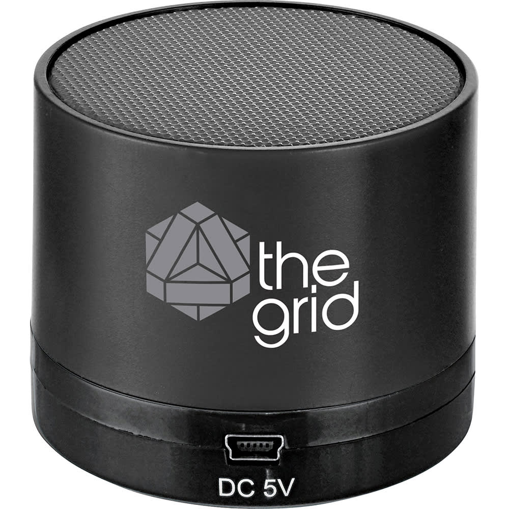 A black cylindrical Bluetooth speaker with a textured top and a logo on the side.