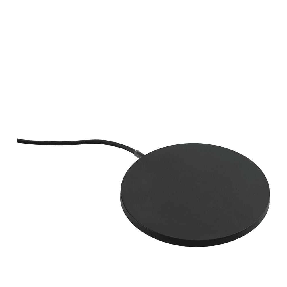 A round, black wireless charging pad with a connected cable, designed for charging devices.