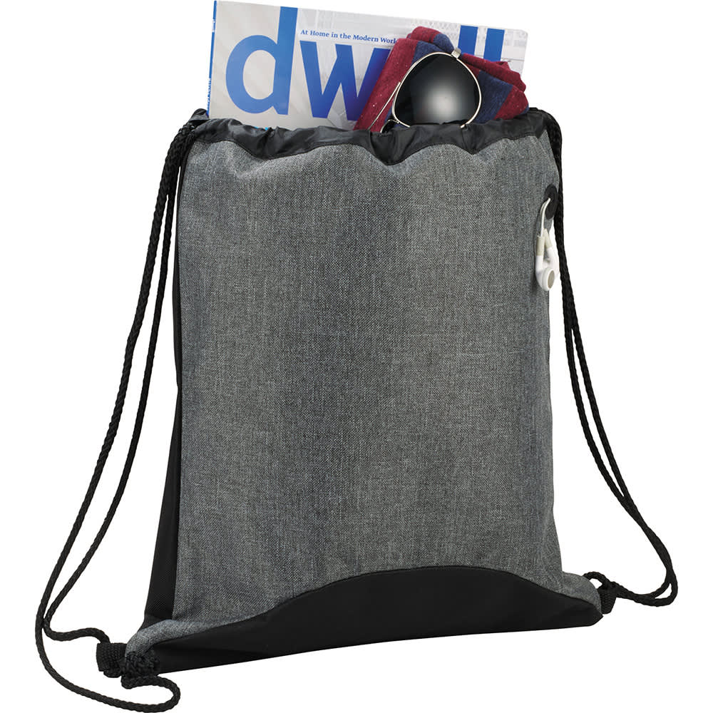 A grey and black drawstring sportspack with a pocket containing a magazine and sunglasses, featuring a logo.