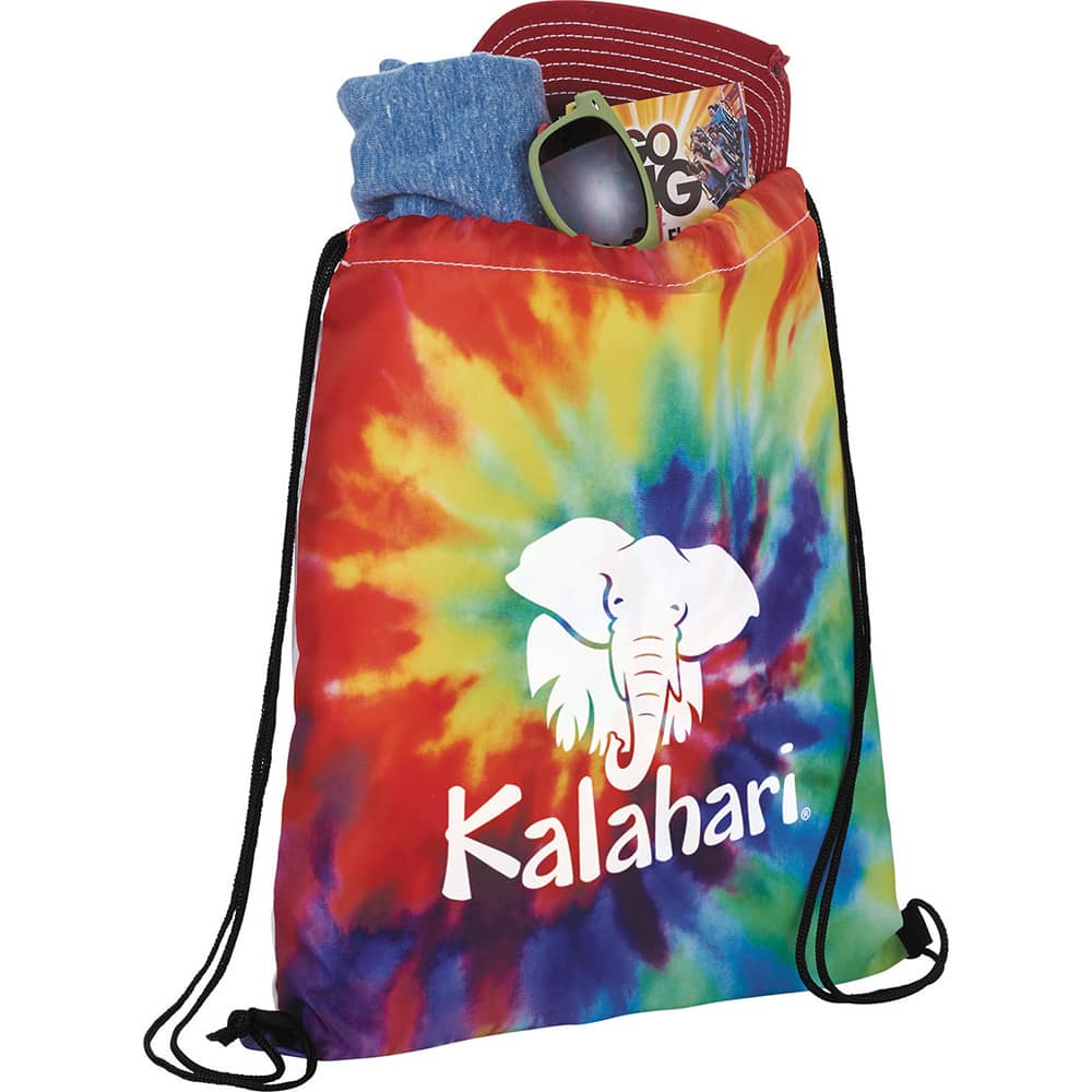 A colourful tie-dye drawstring sportspack featuring vibrant rainbow hues and an elephant logo, filled with a shirt, cap, and sunglasses.