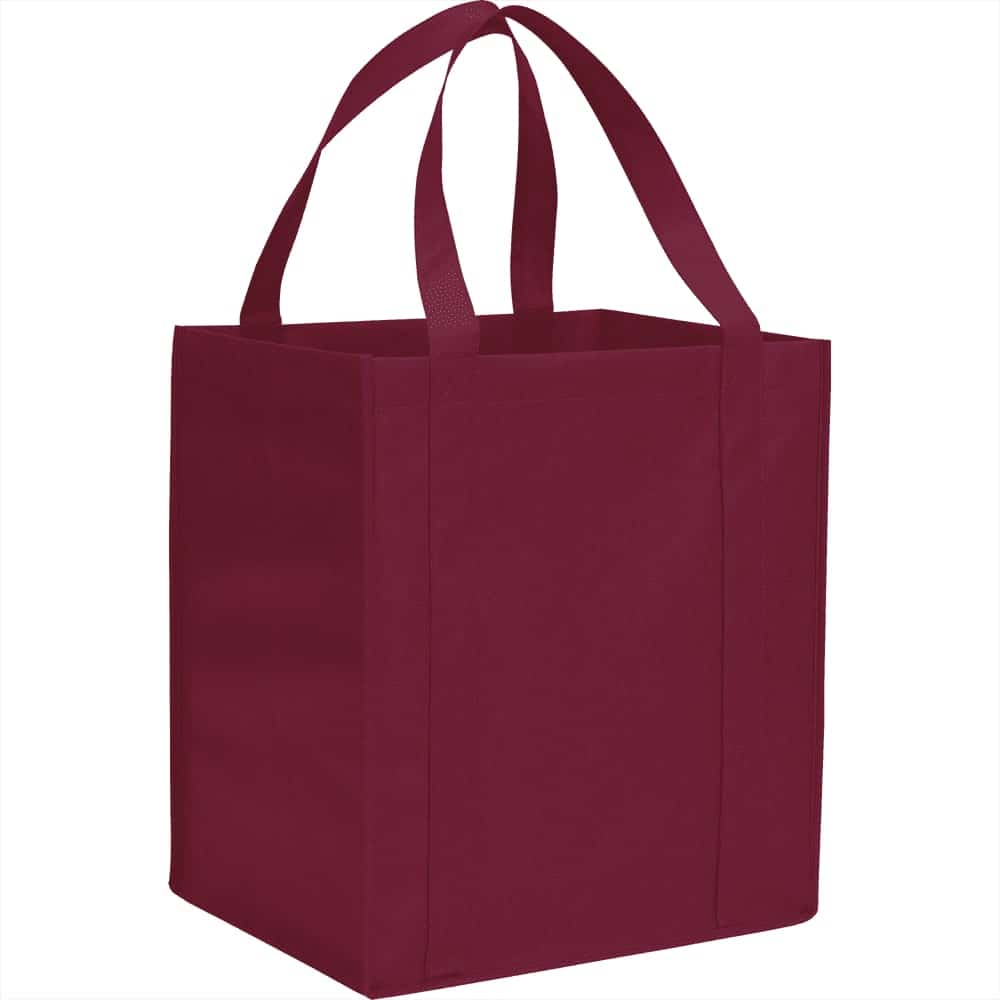 A burgundy reusable grocery tote bag with two handles and a square shape. It has a logo on one side.