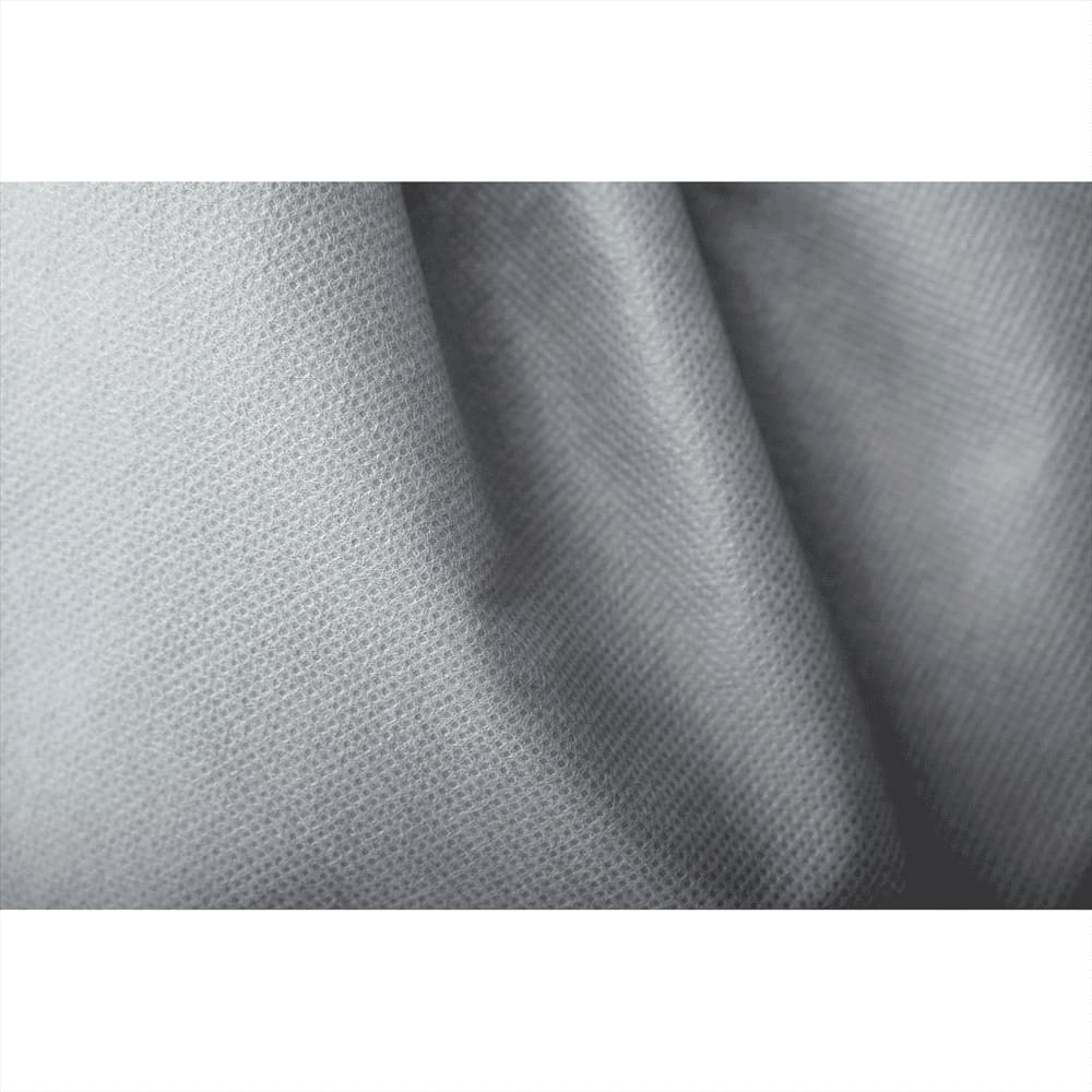 A close-up of light grey non-woven fabric, showcasing its textured surface, ideal for drawstring bags.