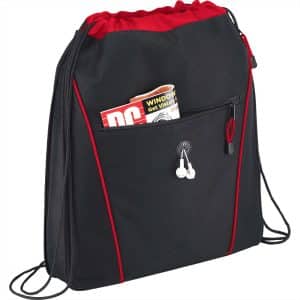 A black drawstring bag with red accents and a front pocket containing magazines and earphones.