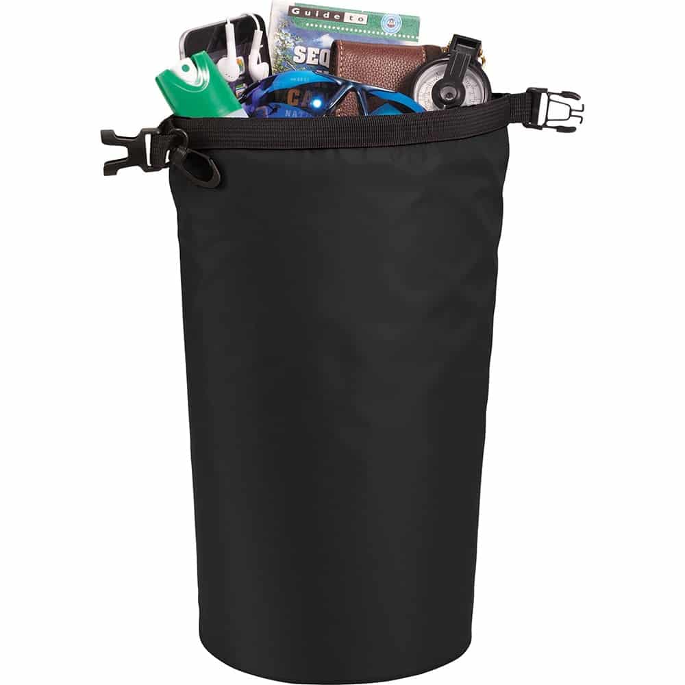 A black waterproof outdoor bag filled with various items like a drink bottle, phone charger, and small accessories.