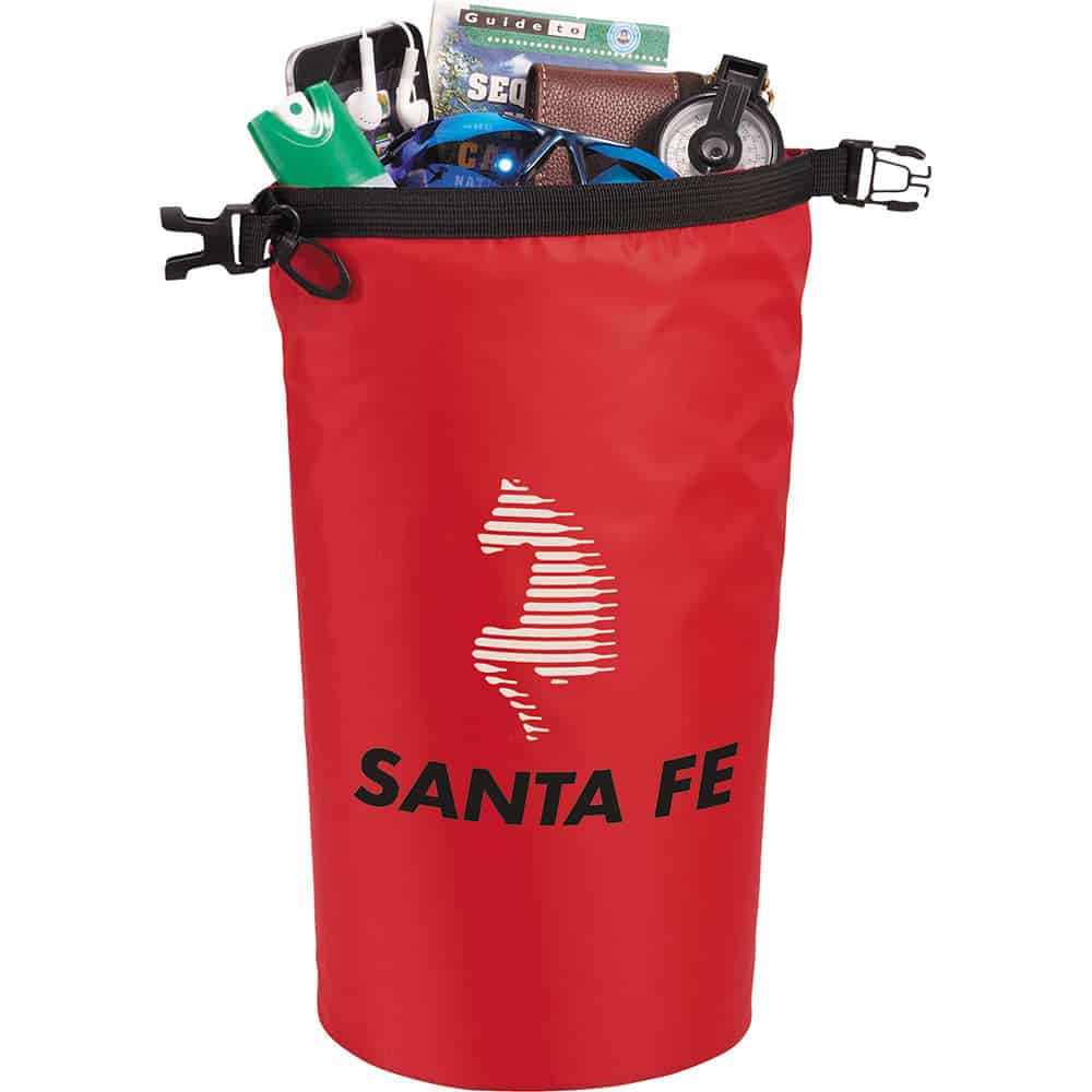 A red waterproof outdoor bag filled with various items, including a drink bottle, wallet, and phone, featuring a logo.