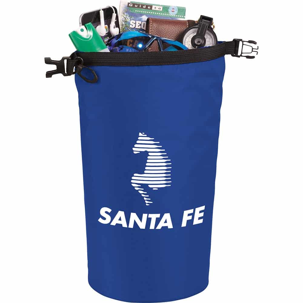 A blue waterproof outdoor bag filled with various items, featuring a logo. The bag is cylindrical with a drawstring closure.