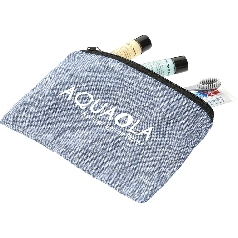 A blue recycled cotton twill pouch with a logo, containing toiletries like lotions and a hairbrush.