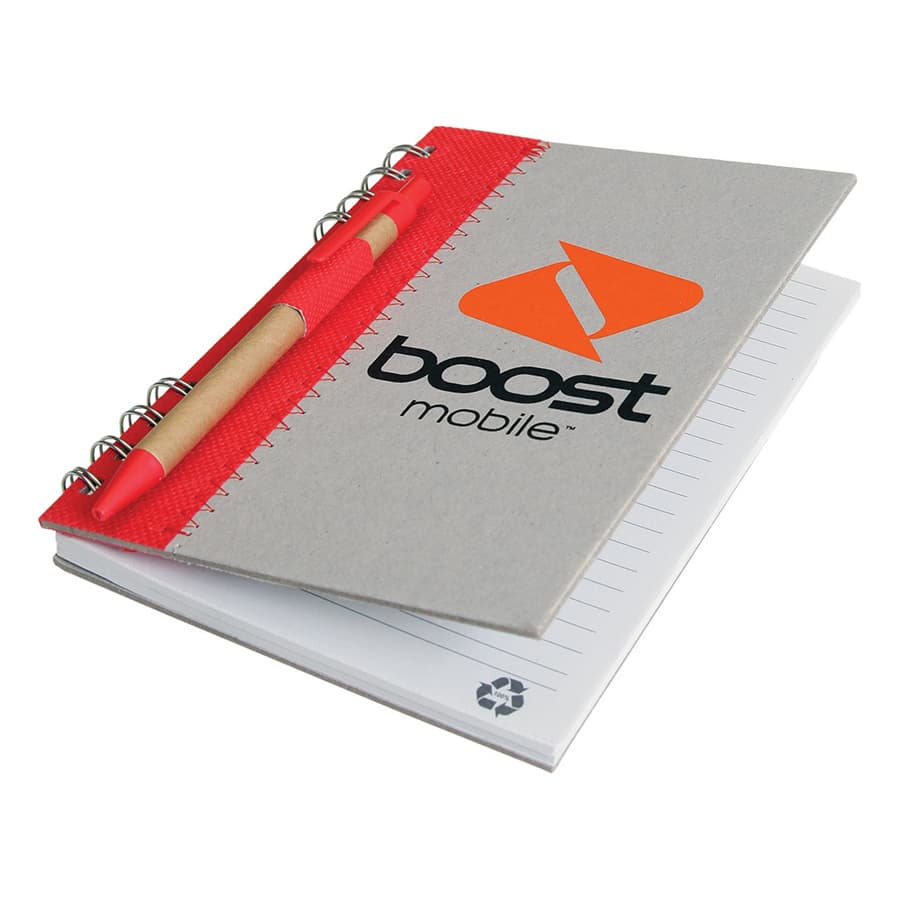 A recycled journal book with a grey cover, red accents, and a pen attached. The journal includes lined pages and a logo.