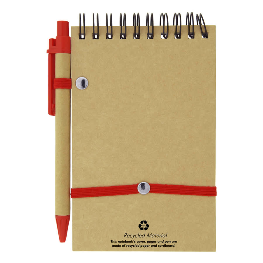 A recycled jotter pad in brown with a red pen, secured by a red elastic band, featuring silver spiral binding.