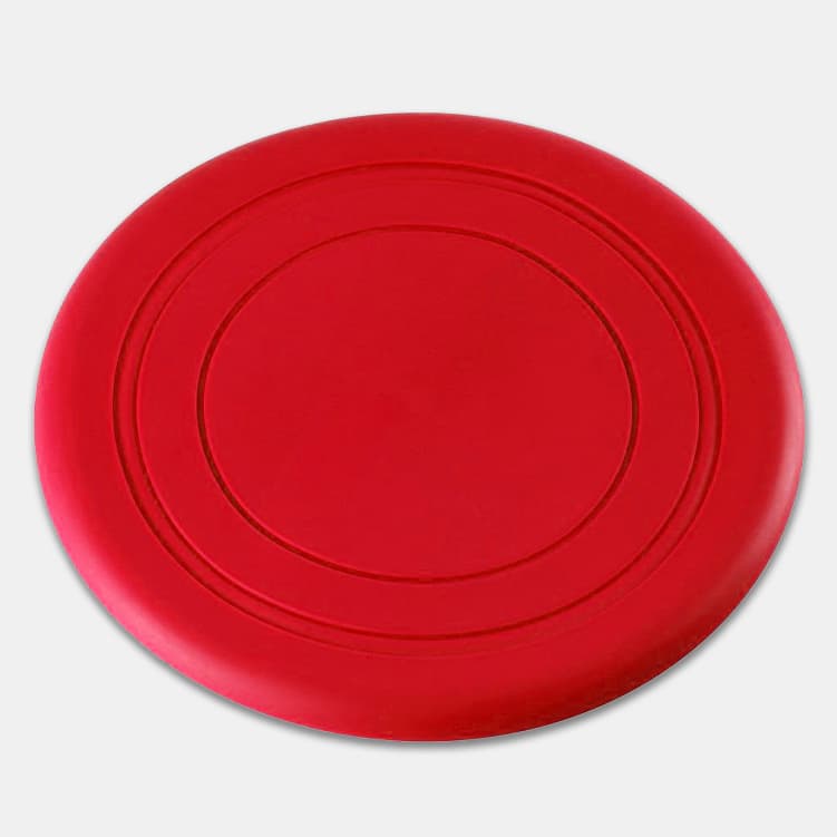A red silicone frisbee with a smooth surface and circular design, featuring an embossed ring pattern.