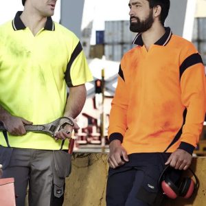 Two men wearing short-sleeve polo shirts in bright yellow and orange, featuring logos and workwear-style designs.