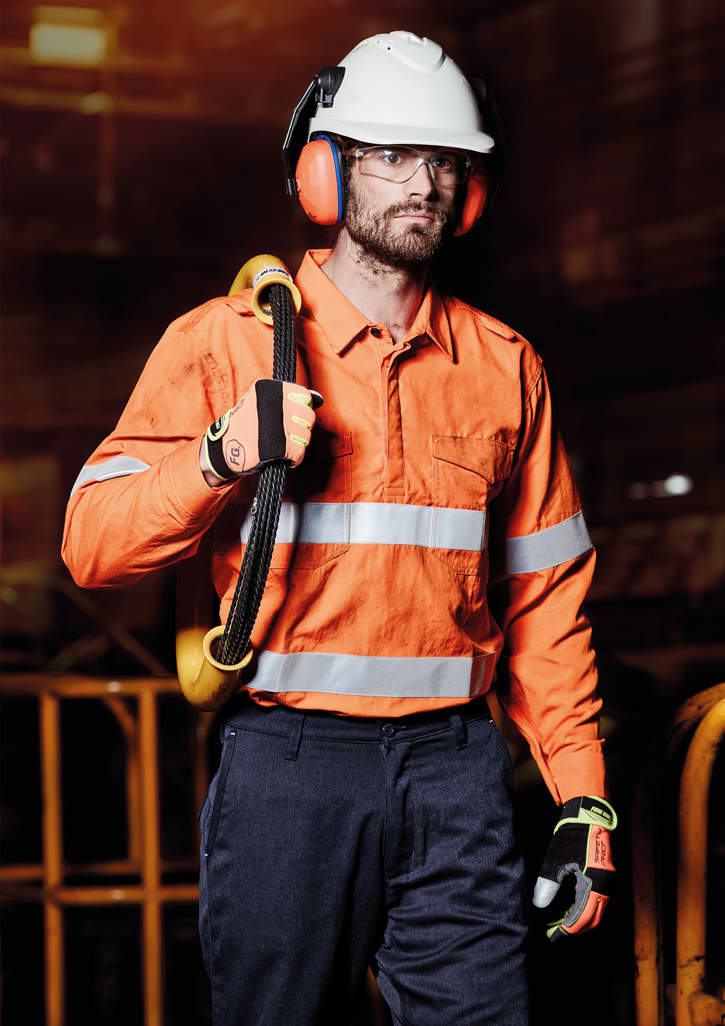 An orange work shirt with reflective tape, worn by a man holding a tool, accompanied by a safety helmet and gloves.
