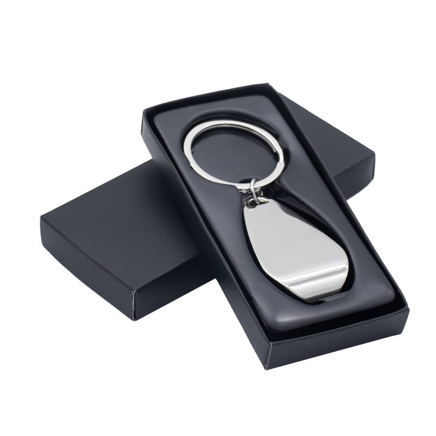 A metallic silver keychain displayed inside a sleek black box with a lid. The box has a smooth finish.