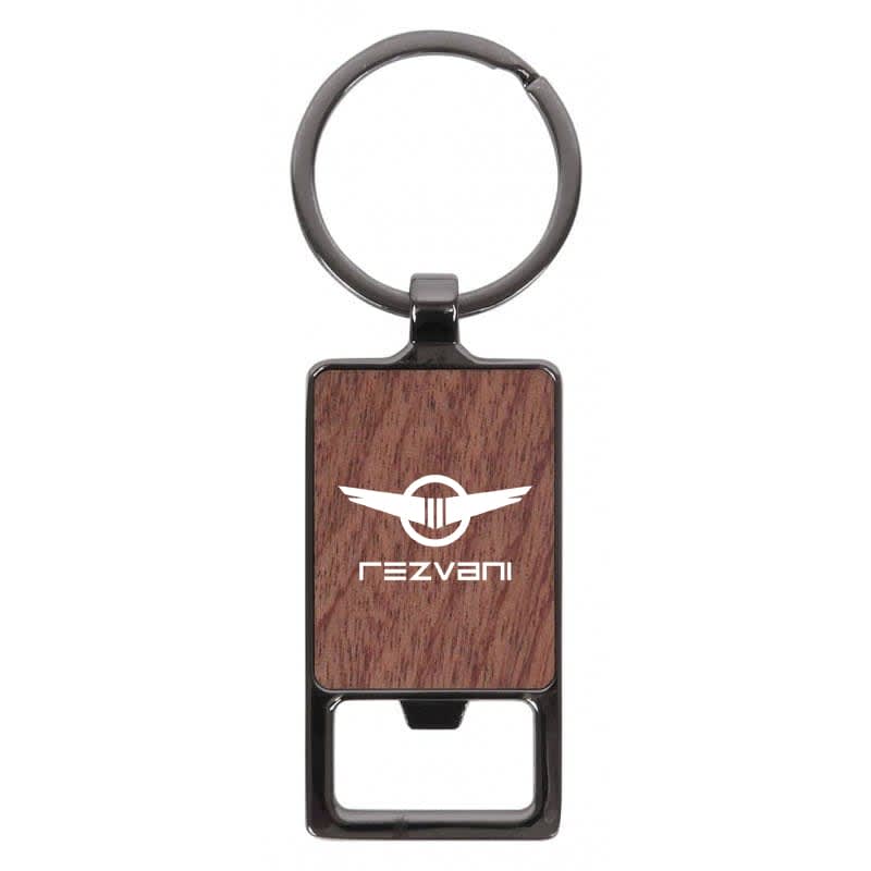 A rectangular keychain with a wood-like texture and a metal keyring. It features a logo on the front.