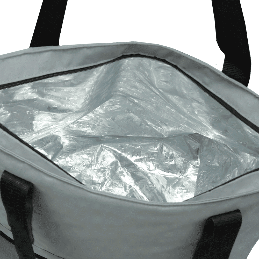 A grey expandable cooler bag with black straps, featuring a front pocket and a logo tag.