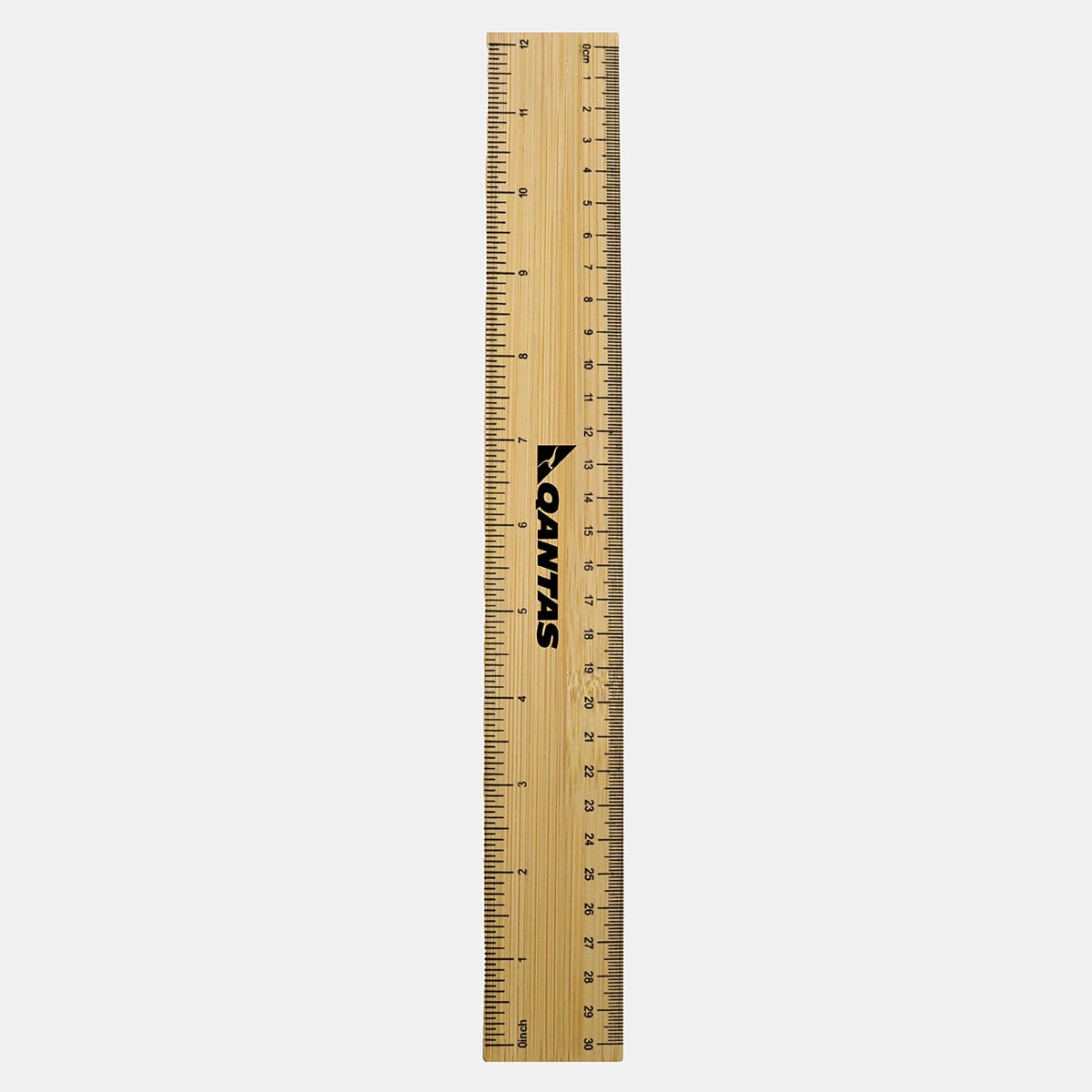 A bamboo ruler featuring metric and imperial measurements. It has a branding logo and a natural wood finish.