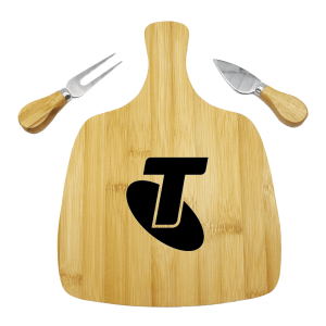 A bamboo cheeseboard with a black logo, accompanied by two wood-handled cheese knives.