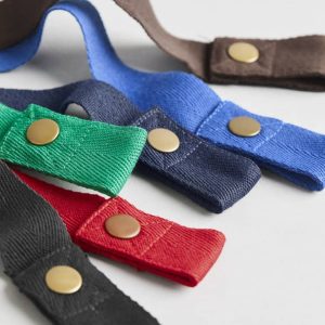A collection of fabric waist straps in green, red, blue, black, navy, and brown, featuring gold studs and a sturdy design.