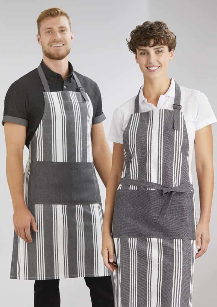 A striped grey and white apron is worn by a smiling man and woman. The aprons have a logo on them.