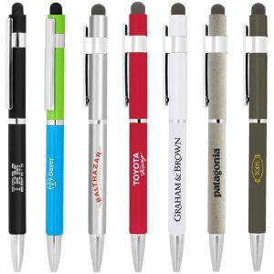 A collection of metal ballpoint pens in various colours, featuring unique designs and logos, including stylus tips.