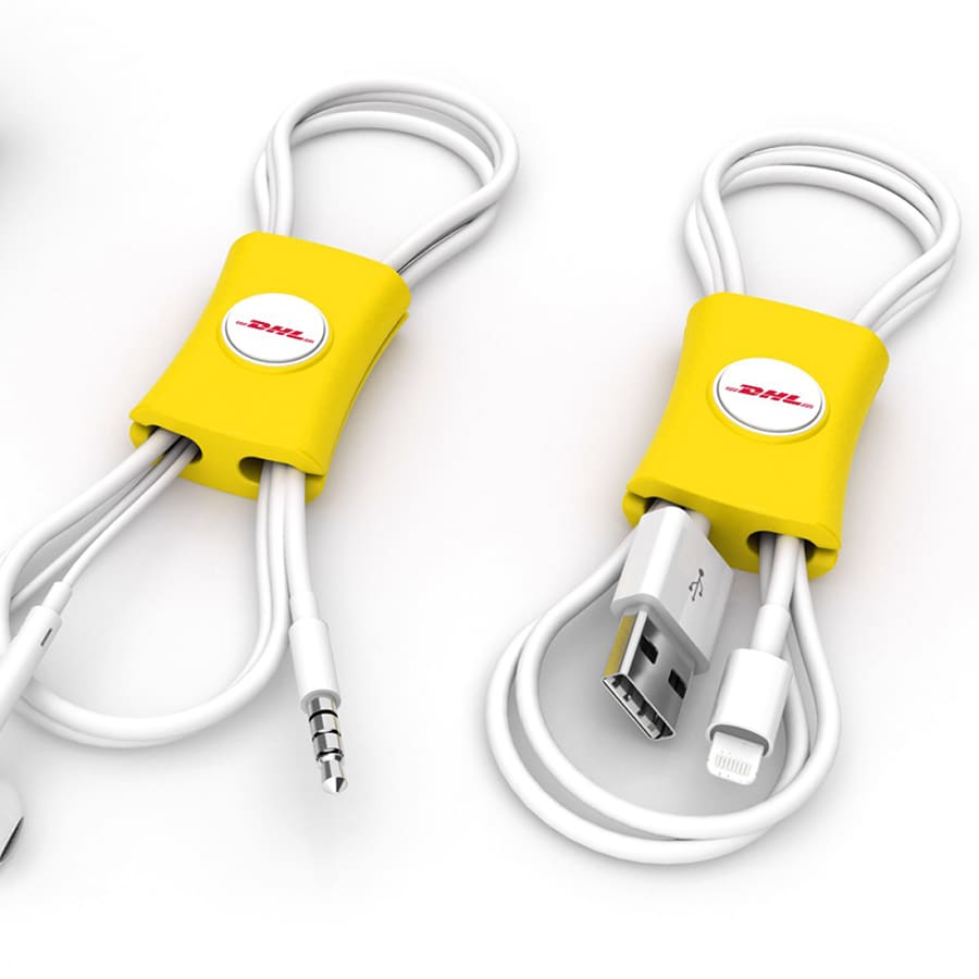 A yellow cable manager designed for tidying phone cables, featuring a circular logo and holding various white cables.