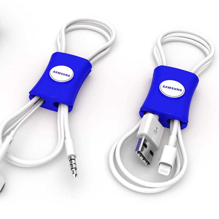 A blue cable manager with multiple white cables neatly organised, featuring a logo on the side.