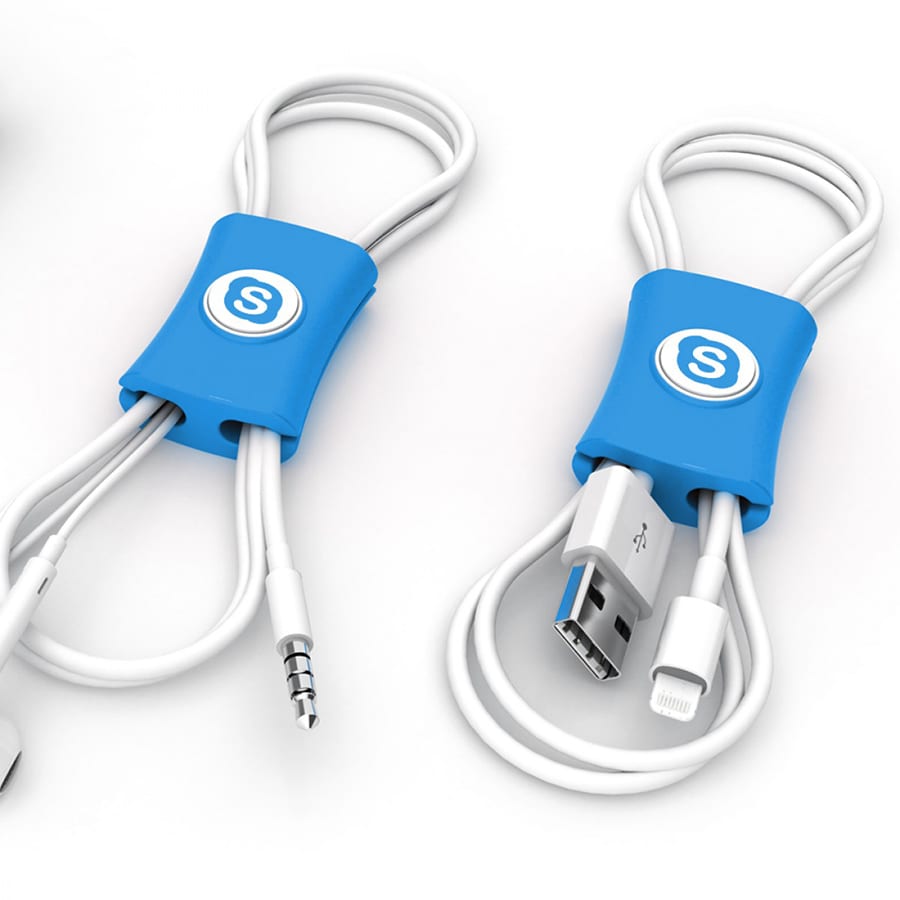 A blue cable manager neatly organising white cables, featuring a circular logo on each piece.