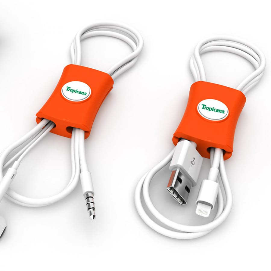 An orange cable manager designed to neatly organise various cables, featuring a logo on its surface.