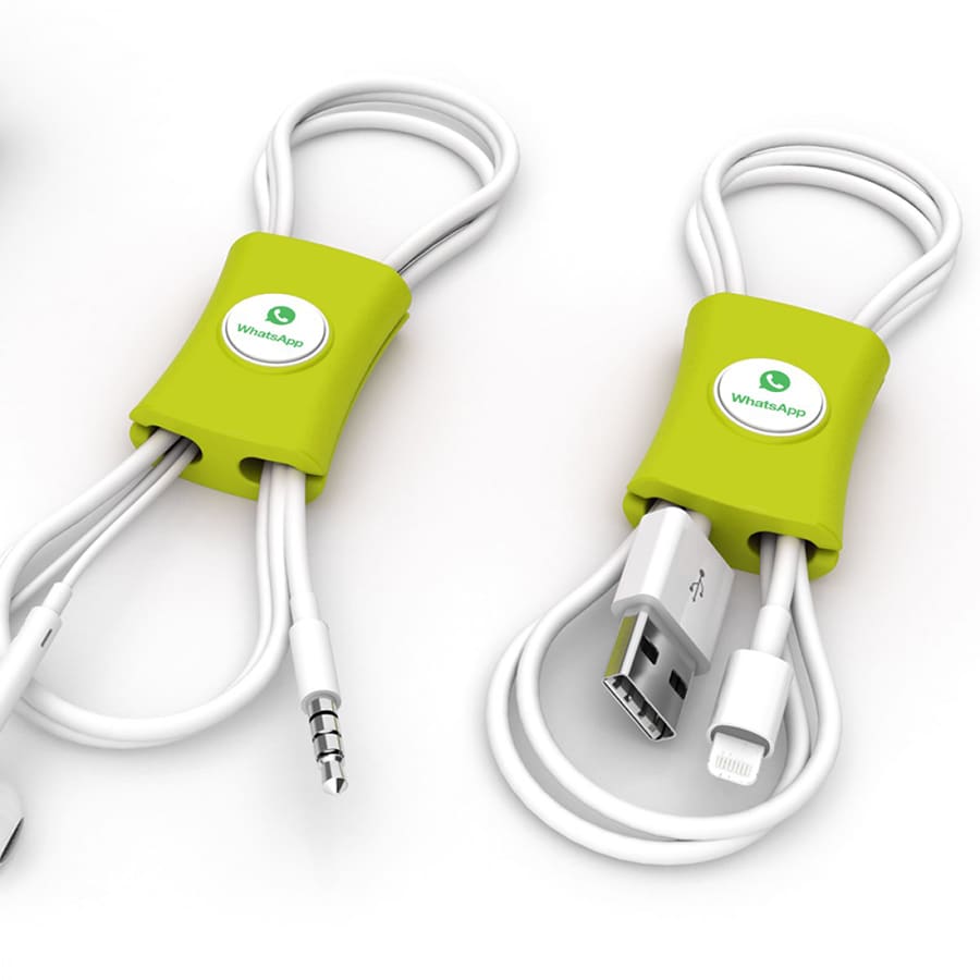 A green cable manager that neatly holds and organizes multiple cables. Features a circular logo.