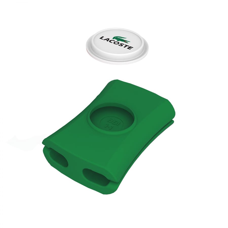 A green cable manager with two openings, accompanied by a round white lid featuring a logo.