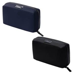 A navy blue tech kit with a zip closure and a logo, featuring a smooth, textured exterior.