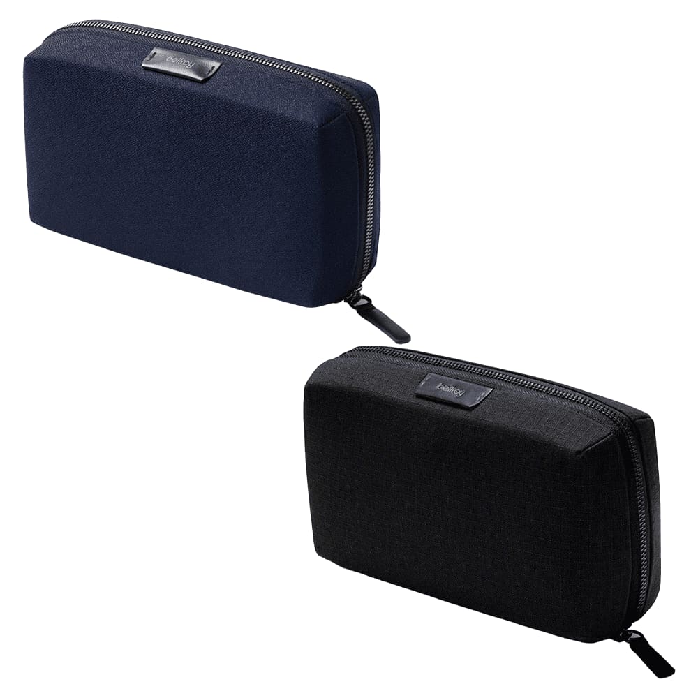 A navy blue tech kit with a zip closure and a logo, featuring a smooth, textured exterior.