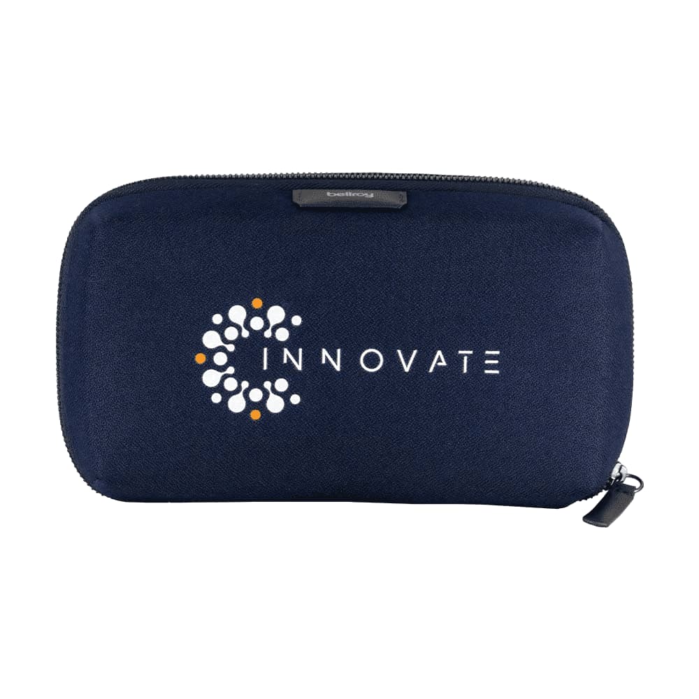 A grey tech kit featuring compartments for a charger, cables, and an airpod case, with a blue interior and a logo.