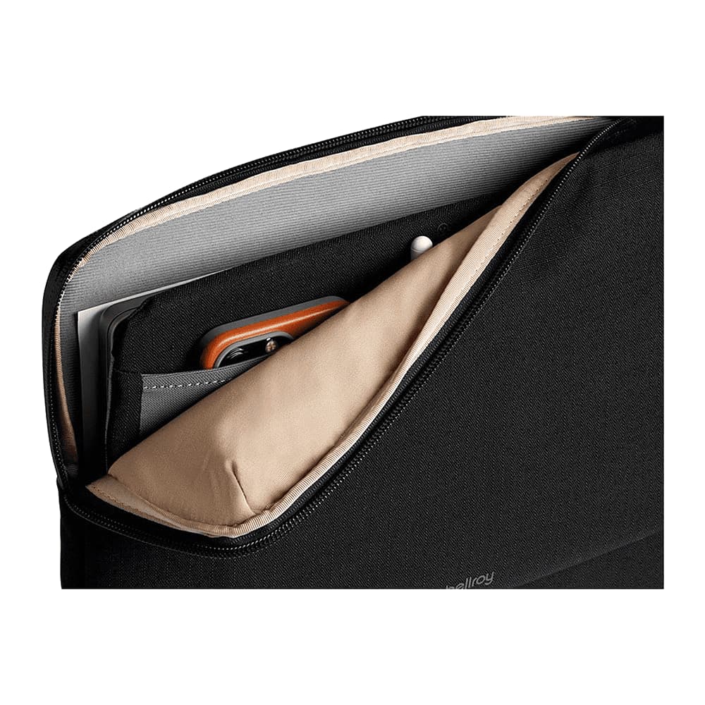 A black laptop caddy with a textured surface and a zip closure. It features a branding logo.