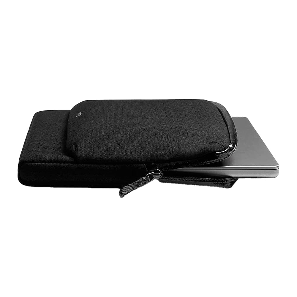 A sleek black laptop caddy with a simple design and a logo. It features a zip closure and a padded exterior.