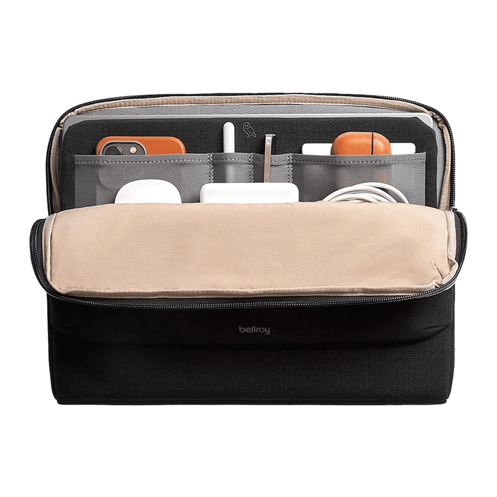 A black laptop caddy with tan lining, featuring compartments for a laptop, documents, and accessories.