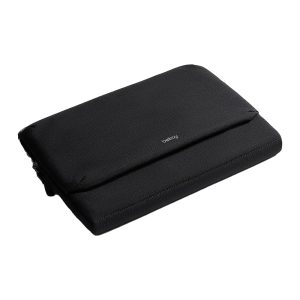A black laptop caddy is held by a person, featuring a logo on the front and a sleek design.