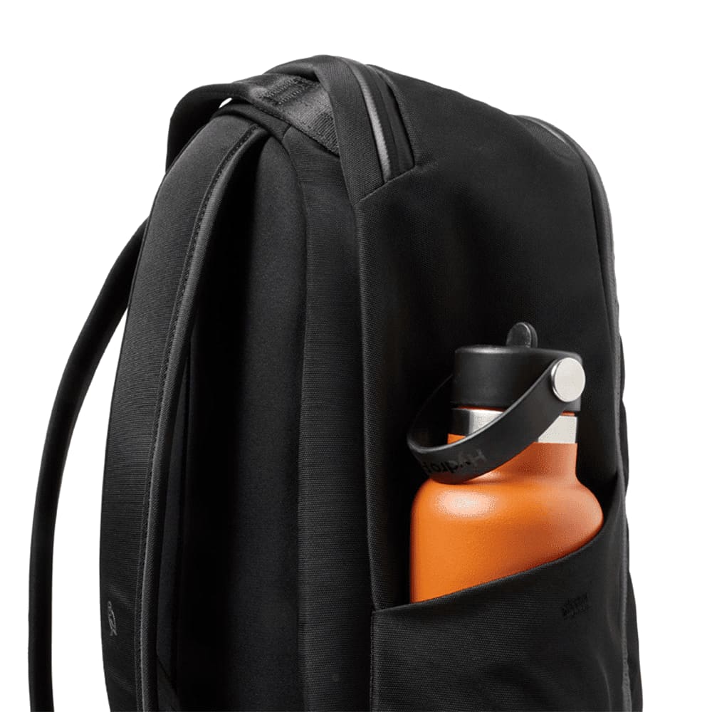 A sleek black backpack featuring adjustable straps and zippered compartments, with a subtle logo on the front.
