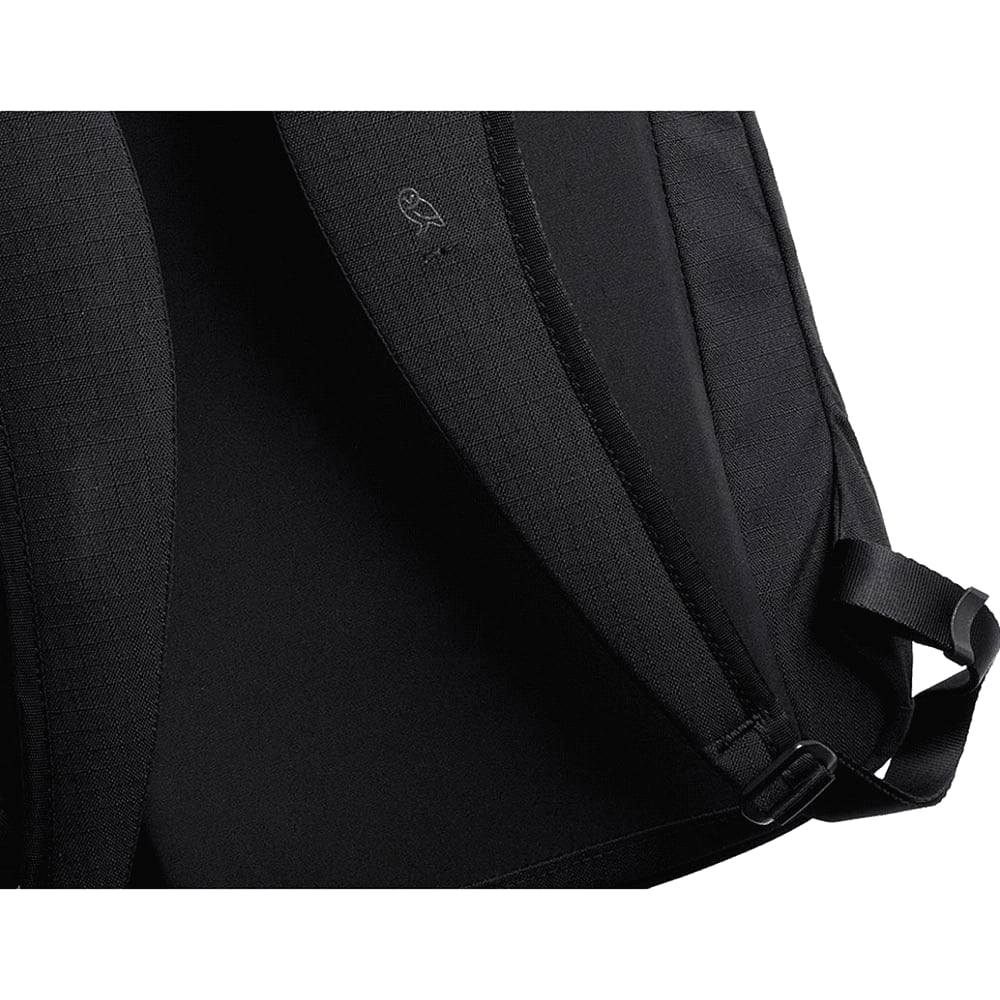 A close-up view of the interior of a navy blue Bellroy Via Backpack, featuring a textured fabric and adjustable straps.