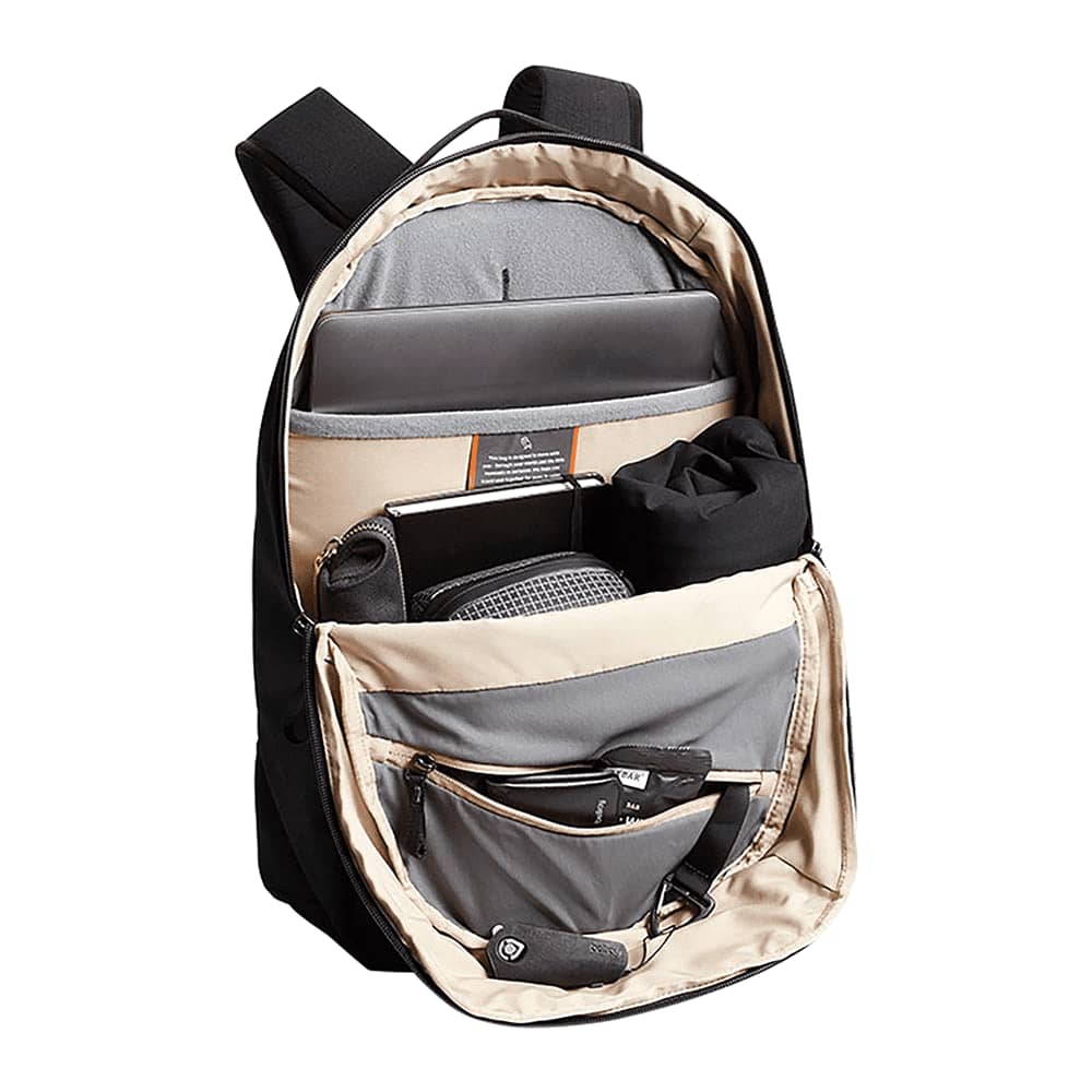 A black backpack with smooth fabric and padded straps, featuring a zippered compartment at the top.